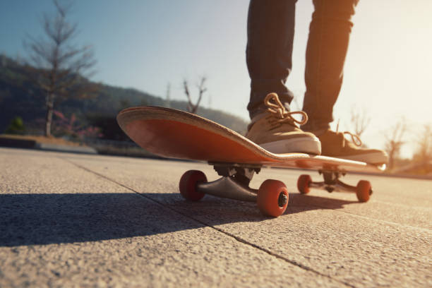 istock Skateboarder skateboarding outdoors on sunny morning 1294814733
