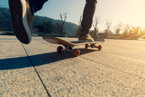 istock Skateboarder skateboarding outdoors on sunny morning 1294815133