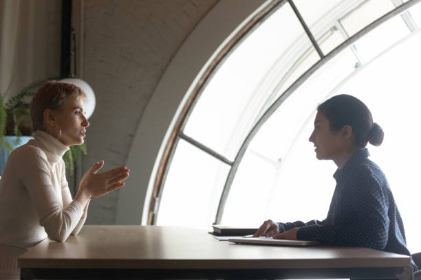 istock Confident Indian hr manager holding interview with candidate in office 1294818738