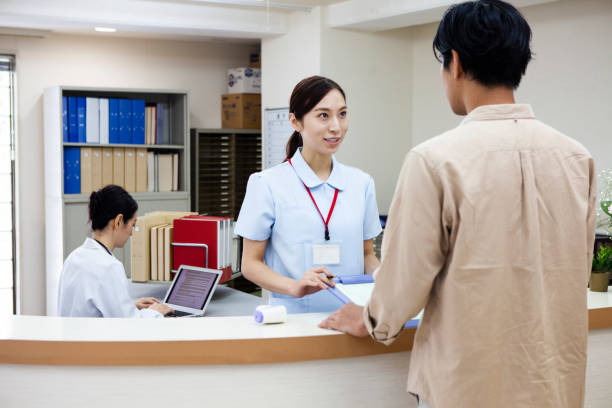 istock A woman at the hospital reception 1294819003