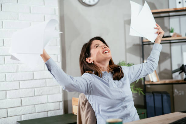 istock Beautiful young woman working on computer at her workplace 1294819395