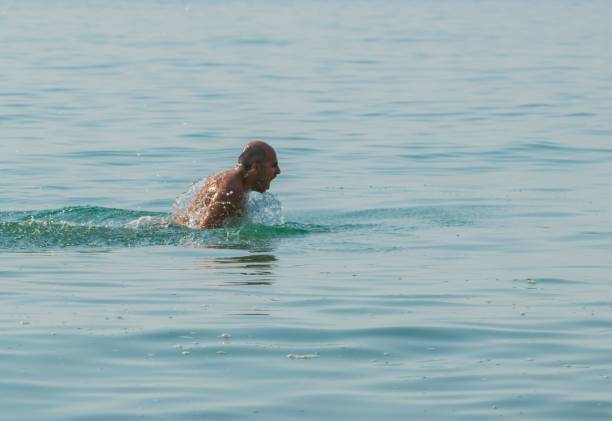 istock man swimming in the sea 1294819707