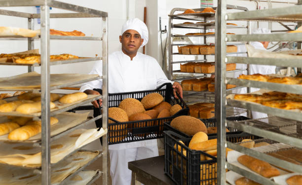 istock Portrait of successful baker during daily work 1294825494