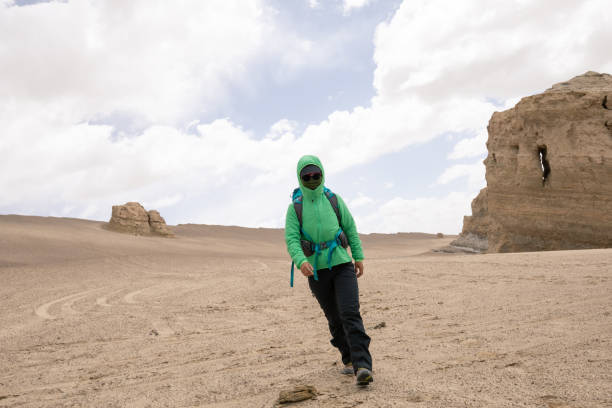 istock Backpacke solo hiking on desert 1294825698