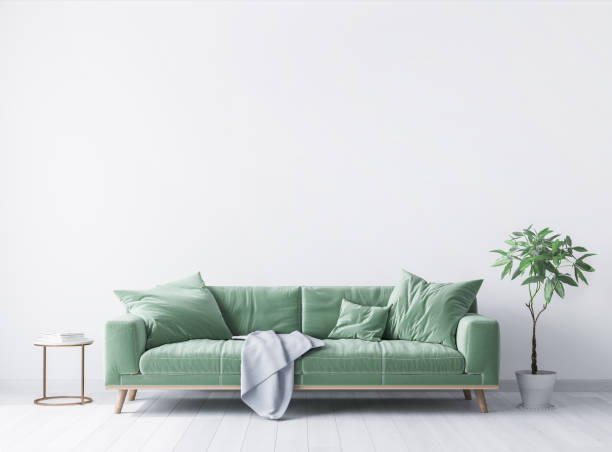 istock interior house with simple white background mock up. green velvet sofa with grey plaid on 1294828375