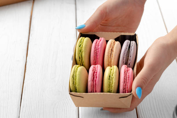 istock Colorful macaron cookies in a cardboard box 1294828494