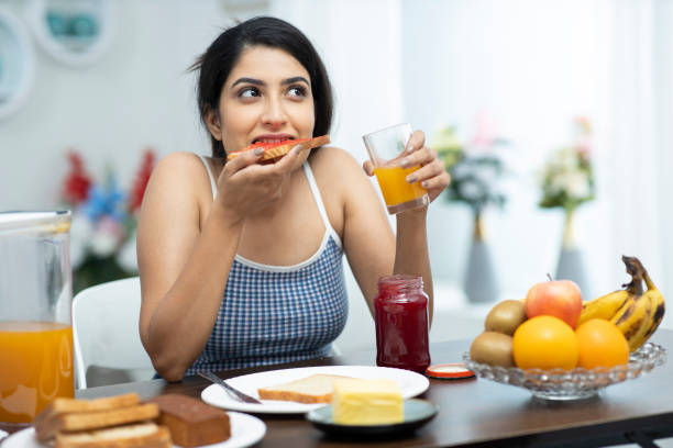 istock young women having breakfast - stock Photo 1294829739
