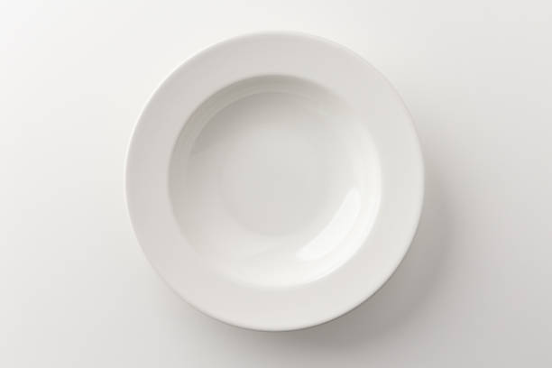 istock Top view White empty plates on a white table. Household equipment 1294830634