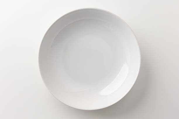 istock Top view White empty plates on a white table. Household equipment 1294830646