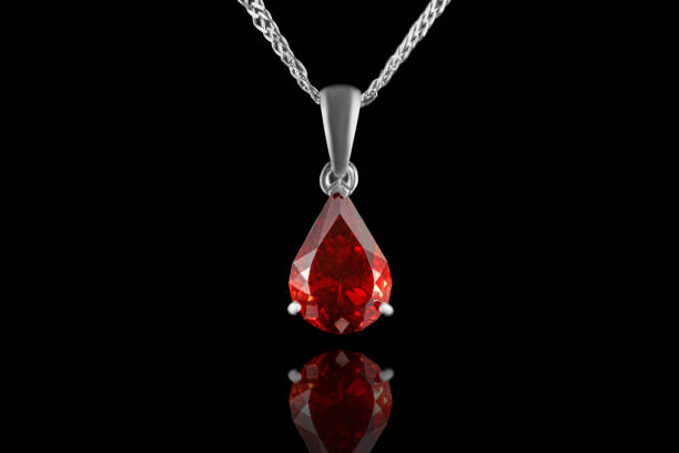 istock beautiful gold pendant with gemstones garnet and diamonds on a black background 1294831476