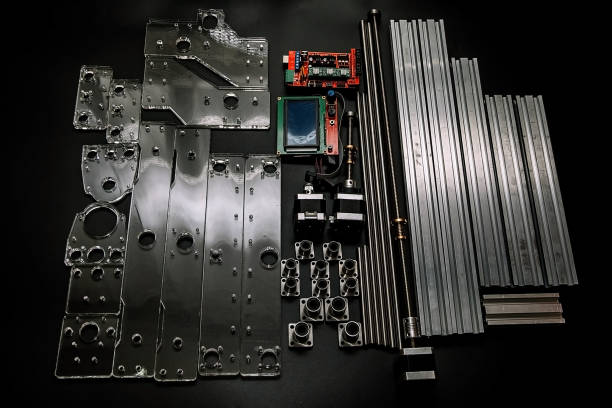 istock a set of parts for a laser machine on a black background, silver backlight, flat lay open-source hardware and software board for controlling the machine and v slot aluminum profile lies 1294832133