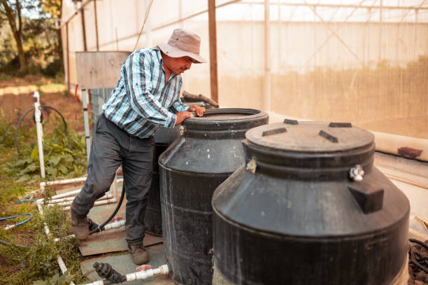 istock The farmer prepares barrels for drip irrigation 1294833797
