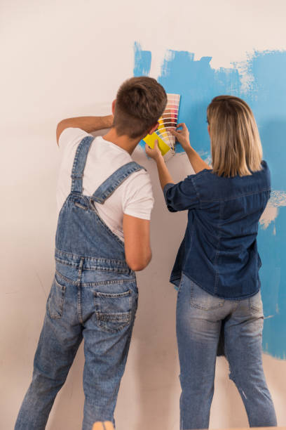 istock Making sure the shade matches the swatch on the wall 1294838279