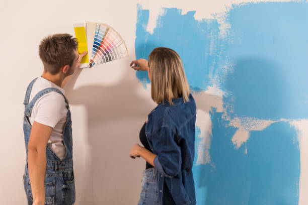 istock Choosing a perfect shade of blue paint for a wall 1294838350