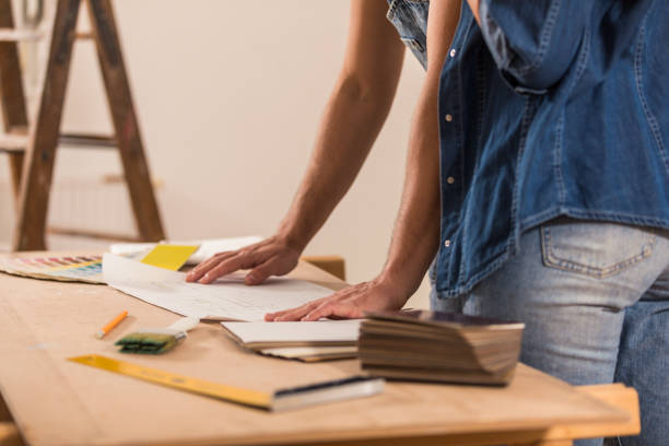istock Planning further renovations while reviewing apartment blueprints 1294838856