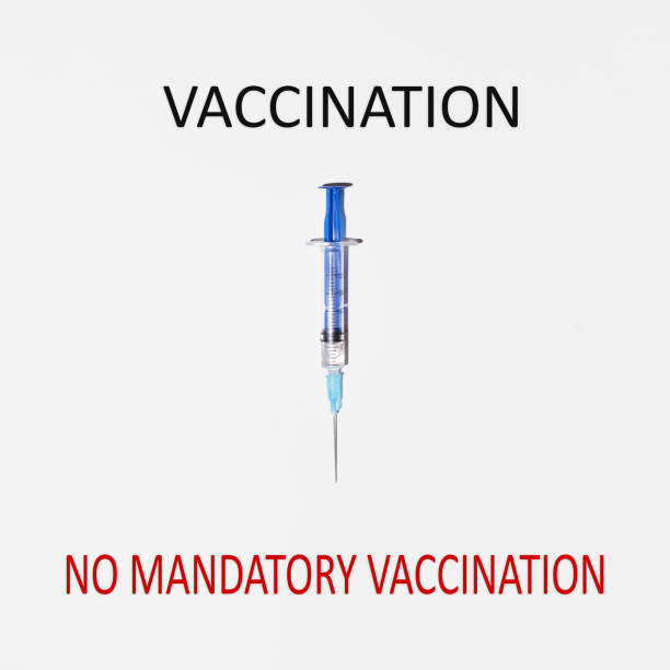 istock Syringe indicating red text No Mandatory Vaccination. Concept of choice between vaccination and non-mandatory vaccination 1294841703