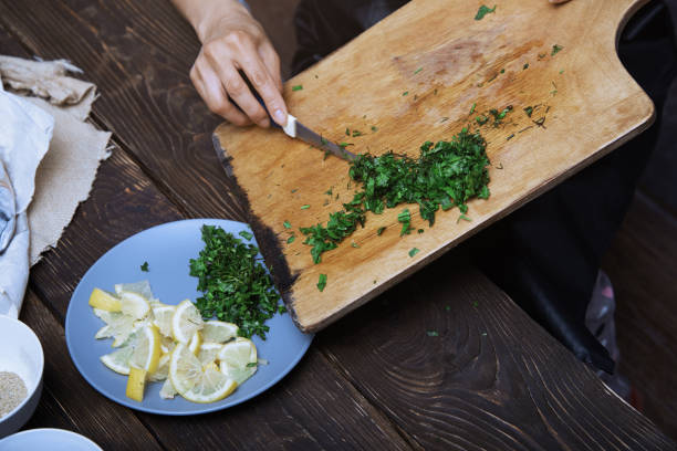 istock Woman cutting culinary plants and vegetables 1294845287