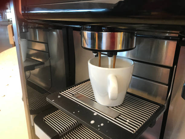 istock Espresso machine making fresh cappucino coffee with a white cup 1294845978