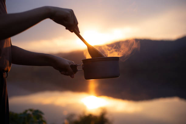 istock Cooking and camping at sunset on holiday 1294848053