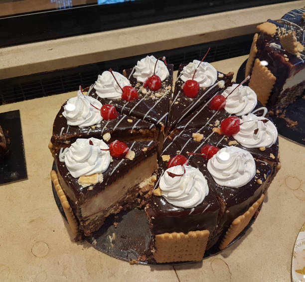 istock pastry cake slice cherry chocolated sweets in frontstor of a shop 1294854561