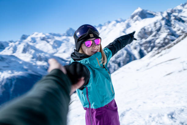 istock Cheerful woman pointing on something in the mountains 1294856788
