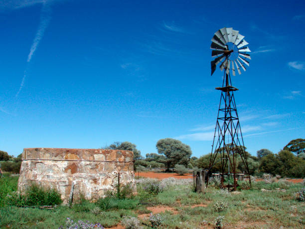 istock Wind mill next to well in Australia 1294858442