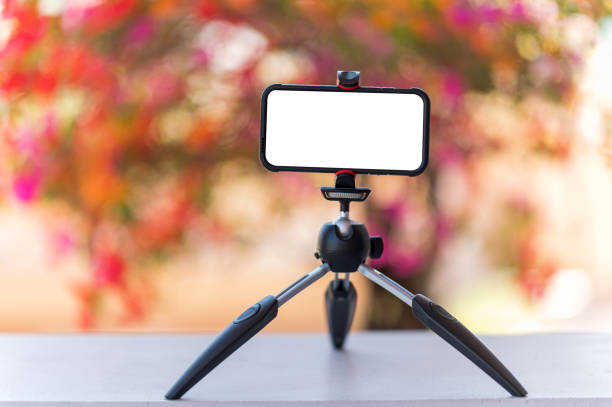 istock Smartphones on a tripod for live video teaching students online 1294862063