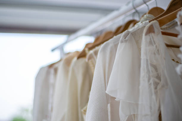 istock Wedding dresses hanging on hanger in Wedding shop 1294864152