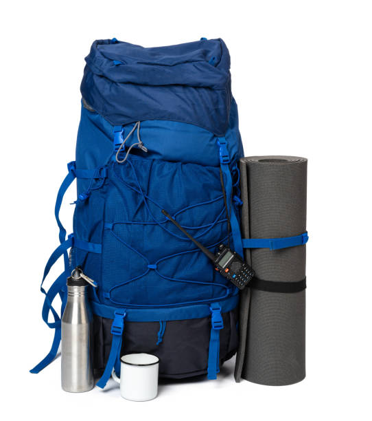 istock Blue hiking backpack with fitness mat isolated on white 1294865347