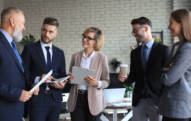 istock Group of business partners discussing ideas and planning work in office. 1294868280