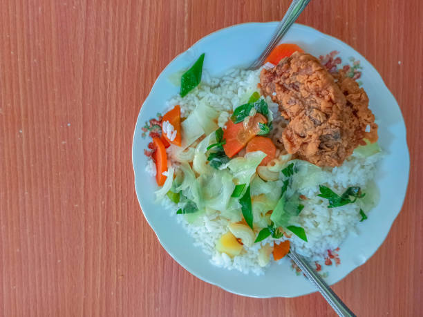 Healthy Breakfast with Rice Fried Chicken with Potato, and Carrot Soup