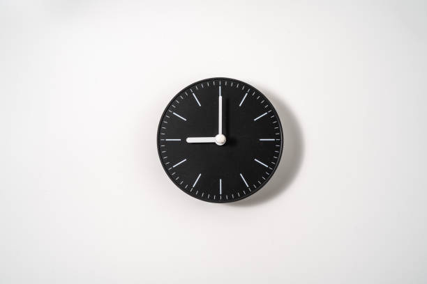 istock close up of an office clock on white background with clipping path 1294871408