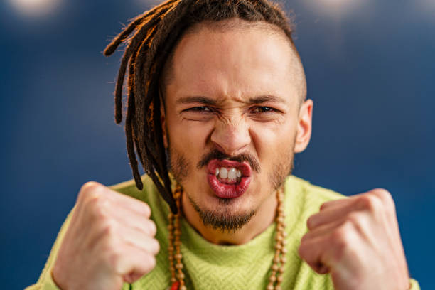 istock Portrait of a happy positive guy with dreadlocks 1294871420