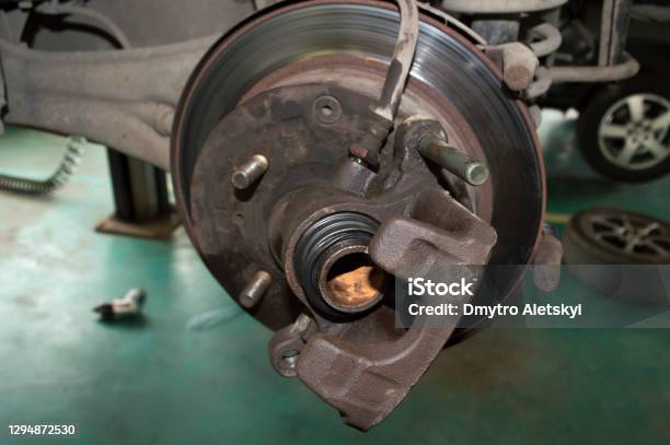 Car Wheel Brake Caliper With Traces Of Corrosion On The Piston Stock Photo - Download Image Now