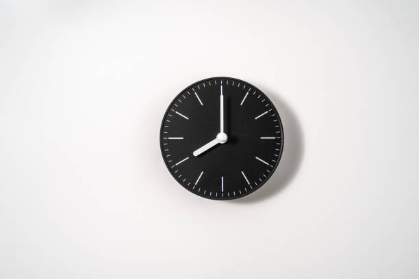 istock close up of an office clock on white background with clipping path 1294872954