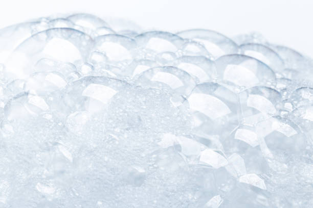 istock Background of soap foam and bubbles on a white background, macro photography 1294875231