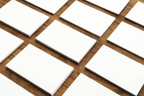 istock Blank businesscard stacks on rough wooden table 1294876503