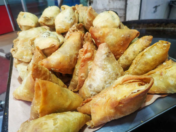 istock Fried samossas on the trey close shot, food background 1294878628