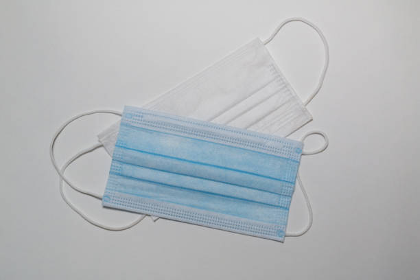 istock medical mask on colored background 1294879973