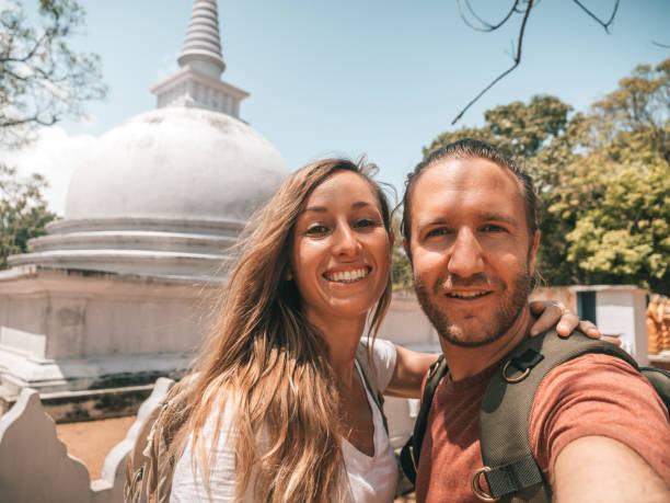 Couple take selfie with temple
