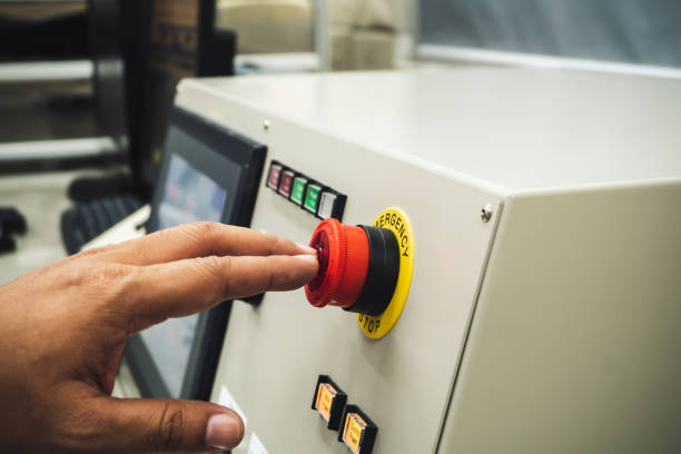istock Male Operator use left hand to push emergency button to stop the machine while accidence occur 1294884364