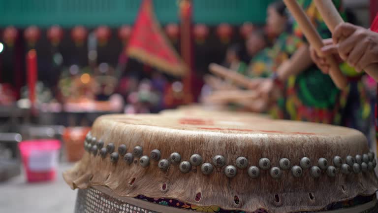 People drumming the Chinese drums to celebrate Lunar New Year