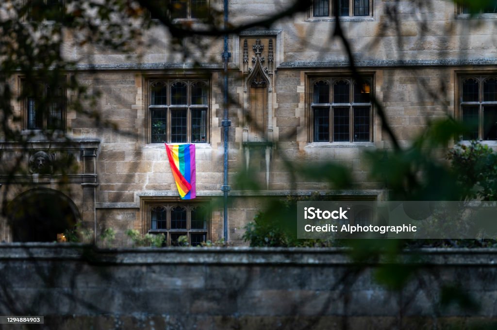 LGBTQI flag on Cambridge University building LGBTQI flag on Cambridge University building. LGBTQIA Rights Stock Photo