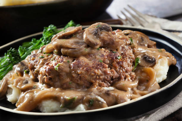 istock Salisbury Steak in a Rich Mushroom and Onion Gravy with Mashed Potatoes 1294890664