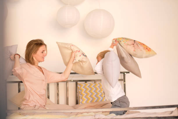istock Young beautiful woman and her son having fun together 1294892088