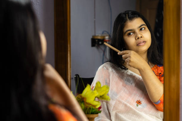 istock Indian woman in front of mirror 1294892164