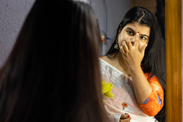 istock Indian woman in front of mirror 1294892173