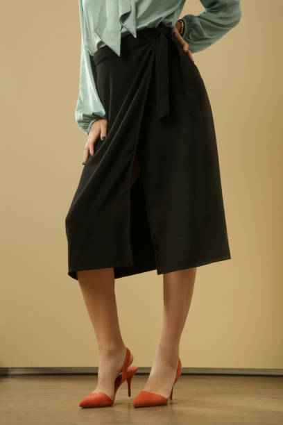 istock Studio shot of black A line midi skirt on unrecognizable model 1294893093