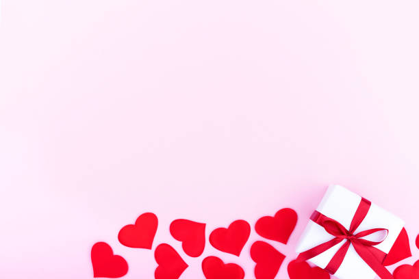 istock Background with gift and hearts with free space for text on pastel pink background. Flat lay, top view. Valentines day concept. Mother's Day concept. 1294893477