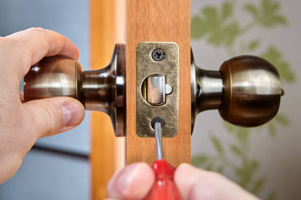 istock Mounting the brass plate for the interior door latch. 1294894174